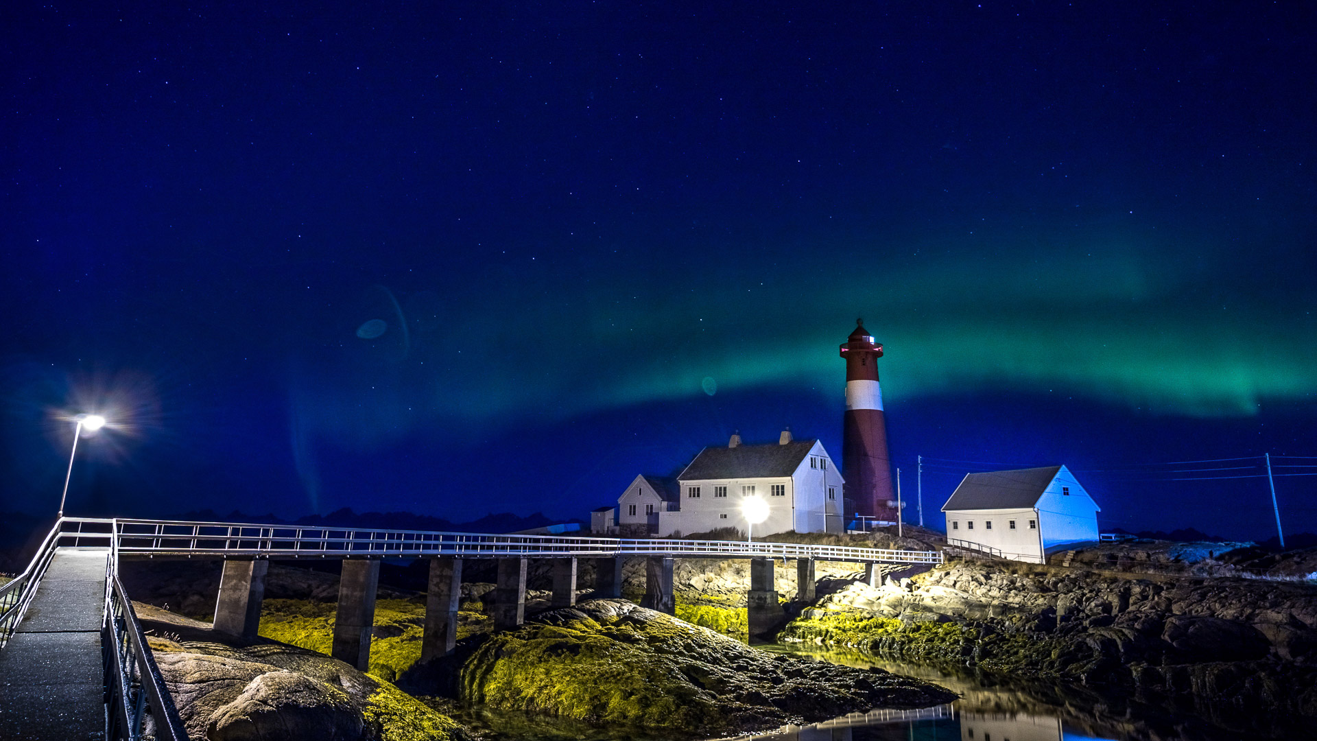 An aurora stripe over Tranøy lighthouse © Flightseeing.de