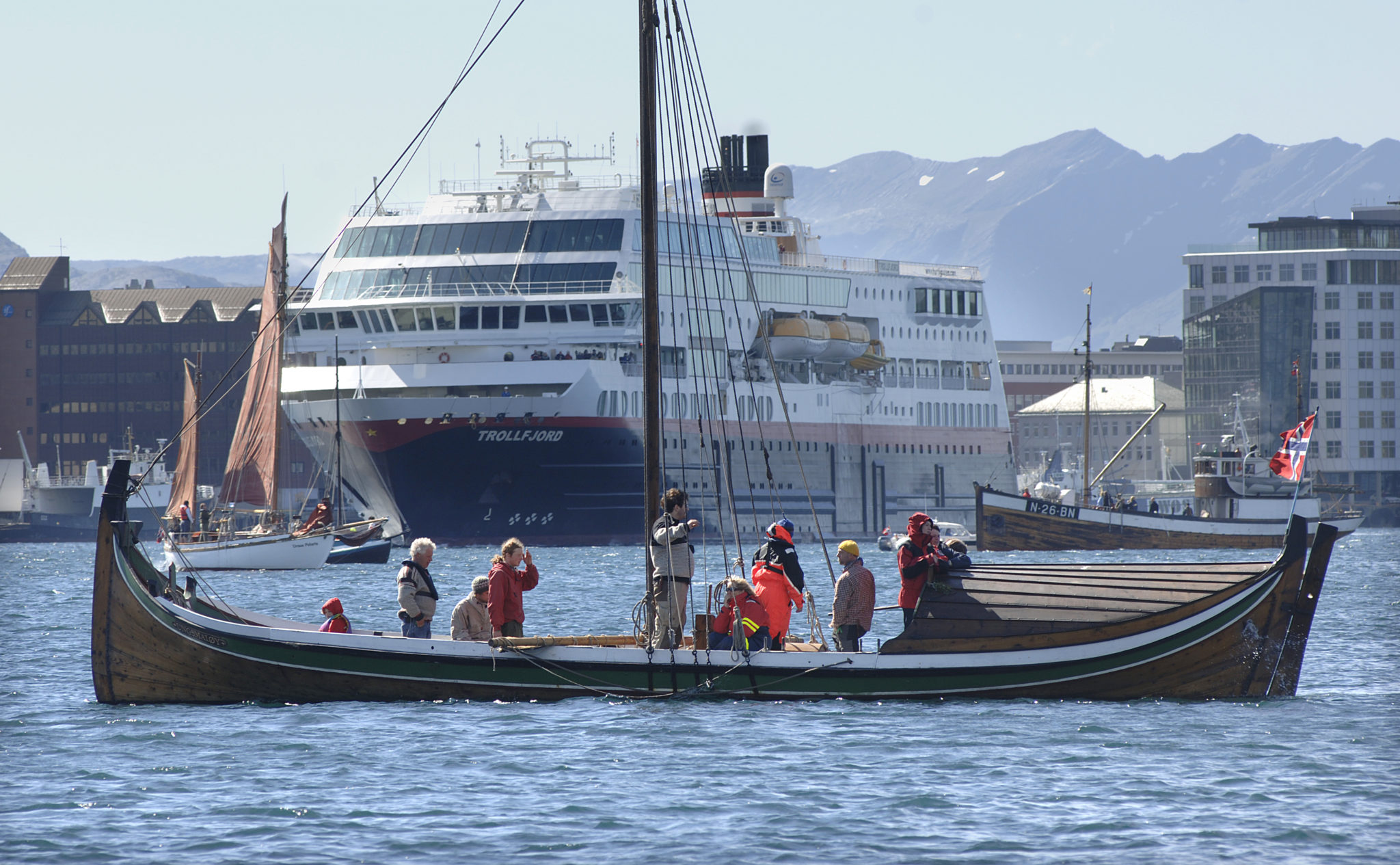 A Nordland Boat making its wayalong the coast of Bodø, with the Hurtigruten boat nearby © Ernst Furuhatt