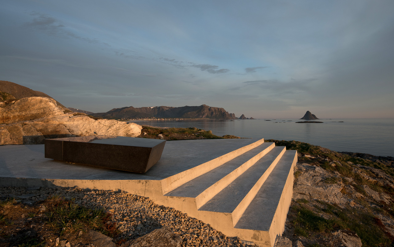 Kleivodden viewpoint at Andøya in the light of the Midnight sun. The fishing village of Bleik and the conic Bleiksøya are in the far back © Roger Ellingsen