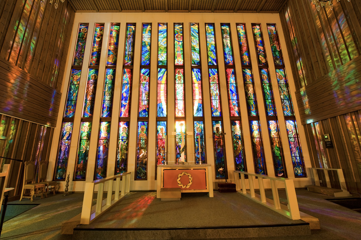 Båtsfjord church's detailed painted glass windows