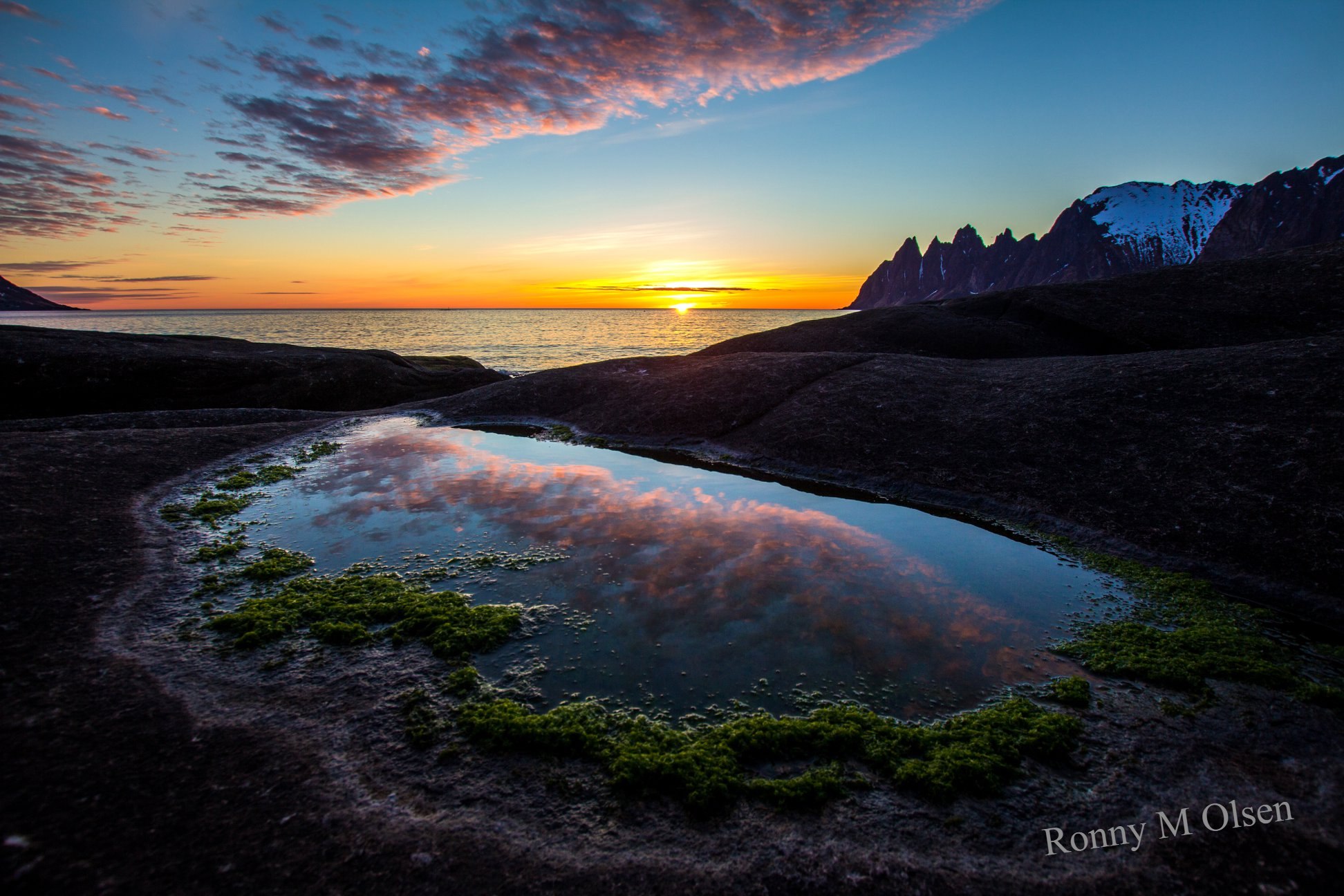 Okshornan cliffs and the Midnight Sun in the ocen © Johnny M Olsen/Hamn i Senja