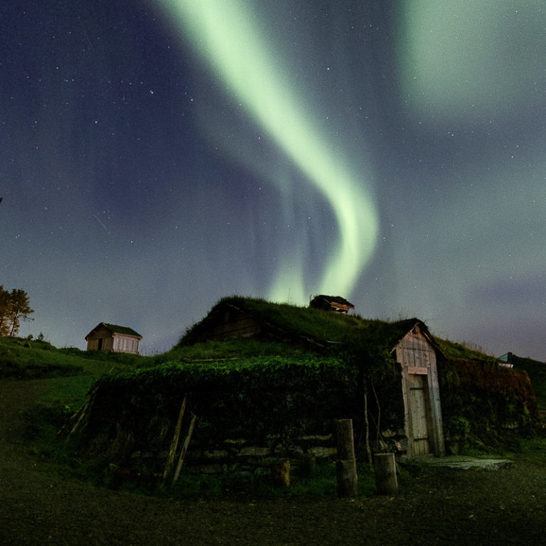 Northern Lights over the main house at the mediaeval farm © Harriet M. Olsen/Sør-Troms museum