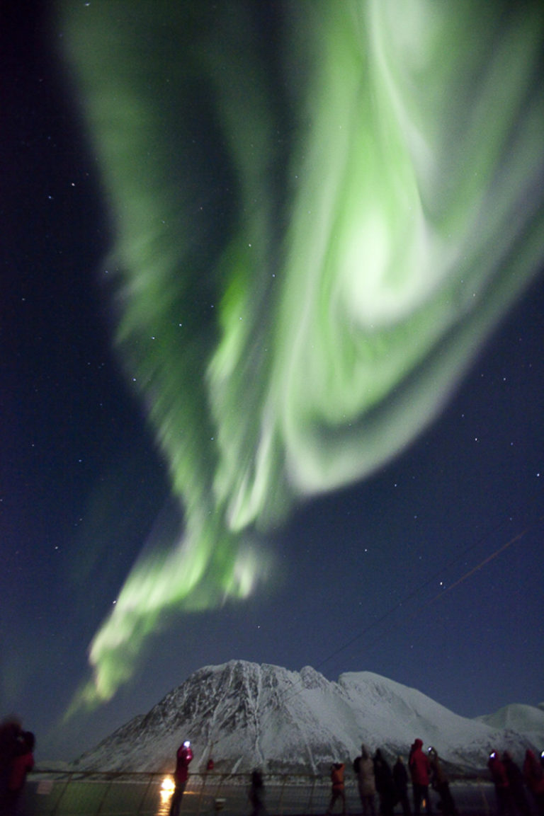 The Northern Lights in the Kågsundet narrows near Skjervøy, seen from the deck of the Hurtigruten © Shigeru Ohki