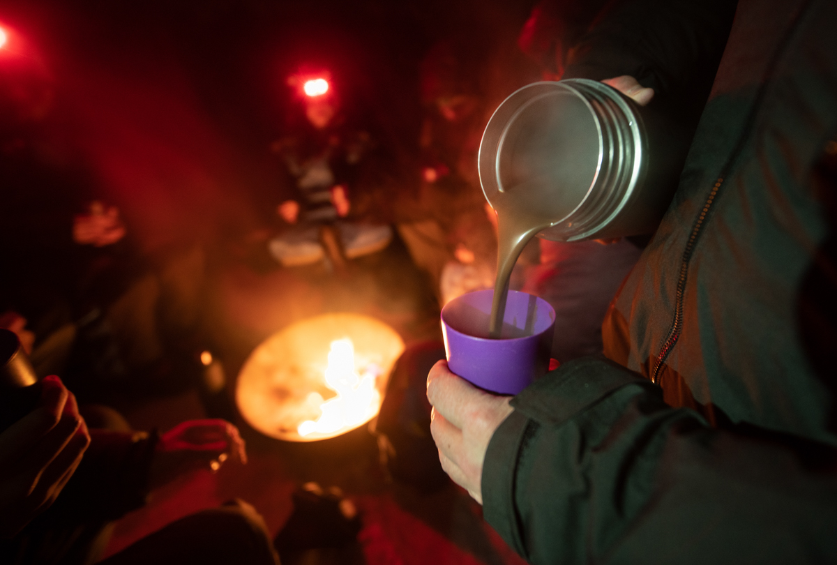 From the campfire after the Northern Lights. Hot chocolate is poured, and the atmosphere is elated © Virgil Reglioni