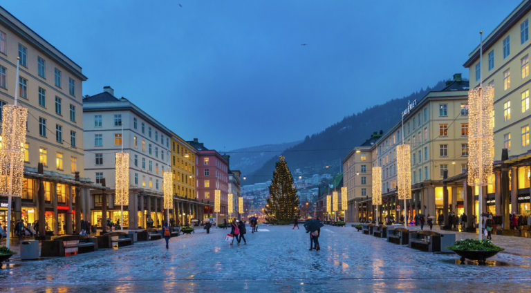 Torgalmenningen square with dusk, Christmas déco and shiny ice © Robin Strand