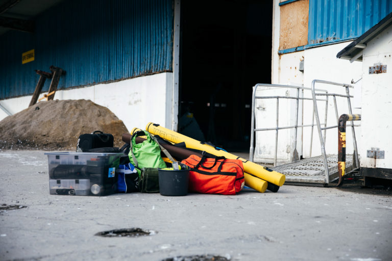 On a dockside in Hammerfest, luggage is ready to be taken to Sørøya Island © Synnøve Tønsberg Gaski/Troms og Finnmark Fylkeskommune