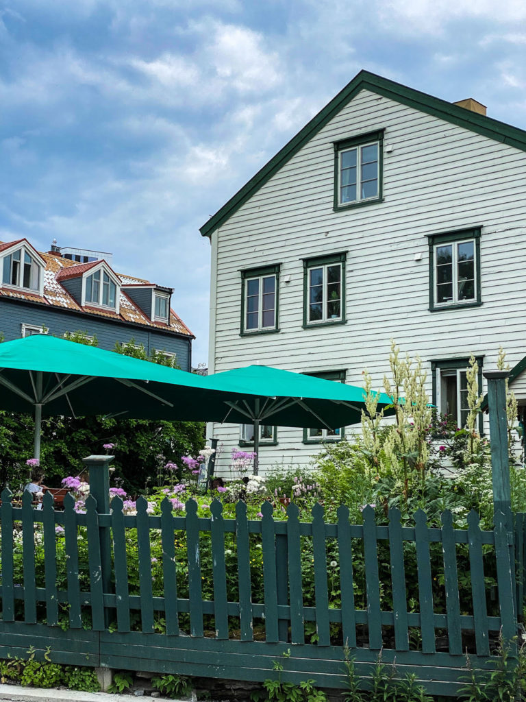 Al fresco cafe in an old house in Søndre Tollbugate street. The garden is the oldest in town, and you can see traditional perennials and historic roses from your cafe chair © Knut Hansvold