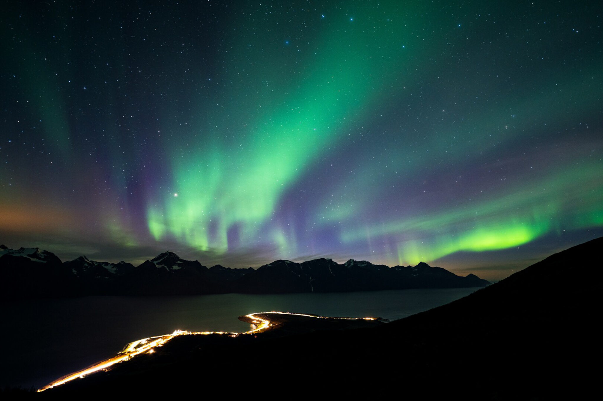From the mountain behind Djuvik an autumn night. No other than Lady Aurora turning up over the Lyngen Alps © Petr Pavlíček