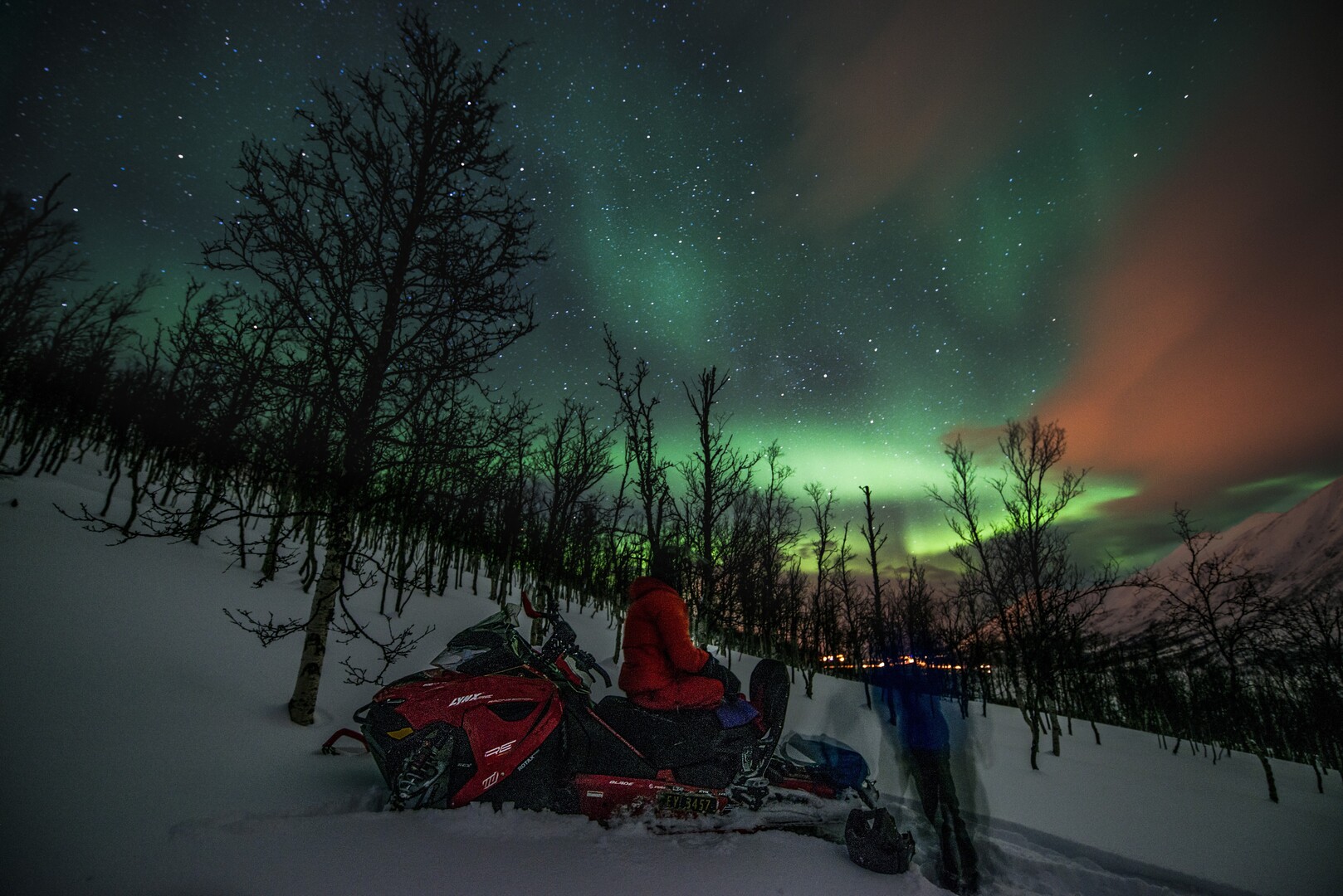 On a snowmobile high above the village. And THERE aurora turned up © Jan Oliver Koch/Visit Lyngenfjord