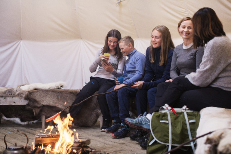 Joyful moments with friends and family in the sami lavoo. Photo: Marie Louise Somby / nordnorge.com