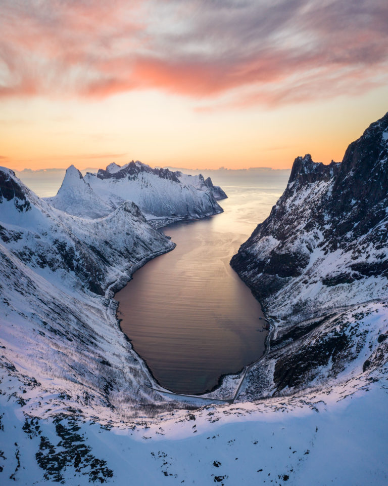 A Senja fjord saying farewell to the sun setting in the sea © Kristoffer Vangen