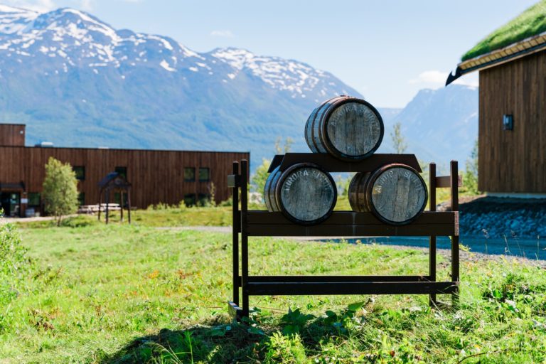 Casks outside Aurora Spirit, Årøybuk in the Lyngen Alps © House of Light/Visit Lyngenfjord