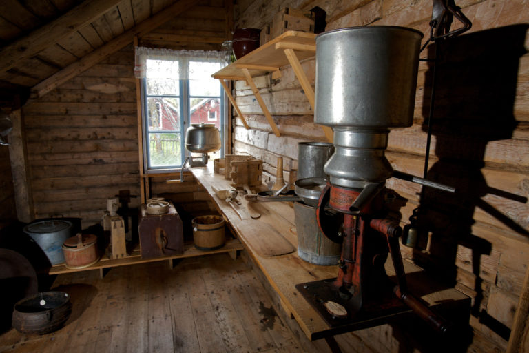 From the mudroom at Gamslett gård / farm. A cream separator is in the foreground © Ola Solvang / Nord-Troms Museum