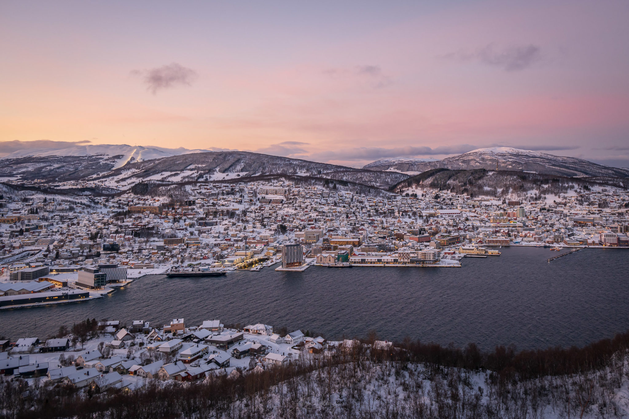 Pink winter light over Harstad, seen from the hill of Gansåstoppen © Arne Widding