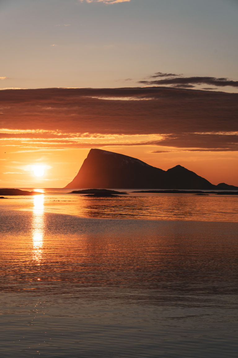 Midnight sun at Håja – "the high island" – a 486-meter high cliff island located in the far west of Tromsø municipality. The view from Sommarøy towards Håja is a popular photographic motif © David Jensen / @jensenmedia