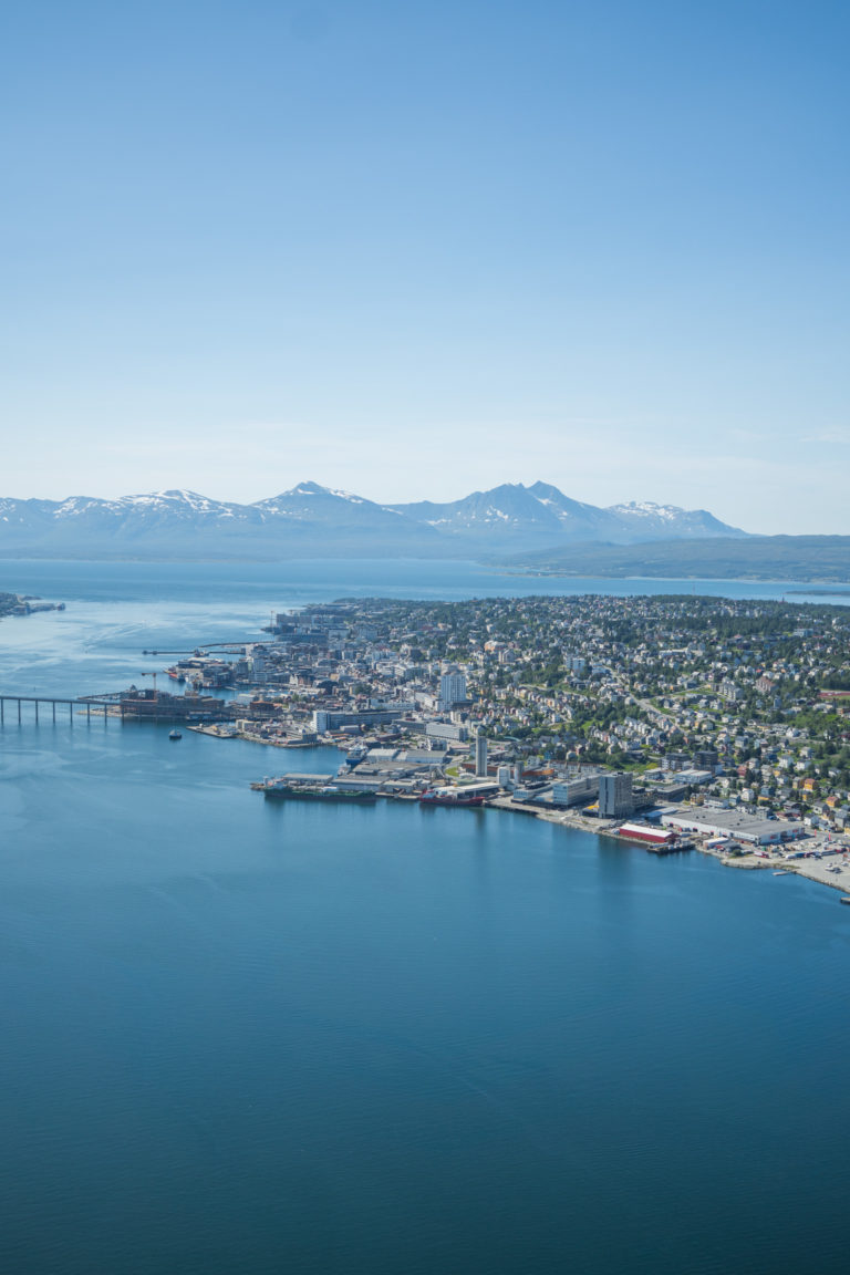 Summer view over Tromsø city centre with the mountains of Malangshalvøya in the distance © David Jensen / @jensenmedia