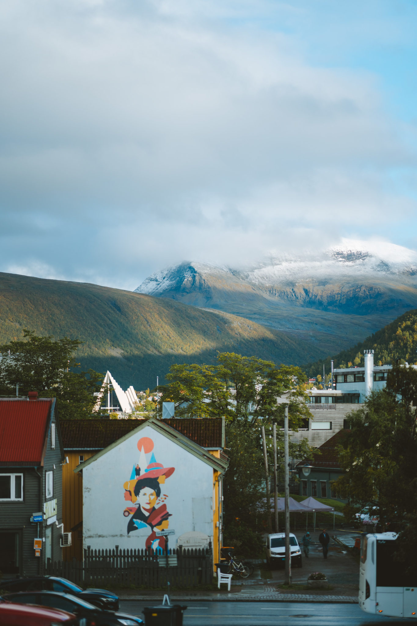 The neighbourhood Nordbyen in Tromsø is full of people just as the first snow of autumn falls on Mount Tromsdalstind © Vegard Stien / Raw Studios