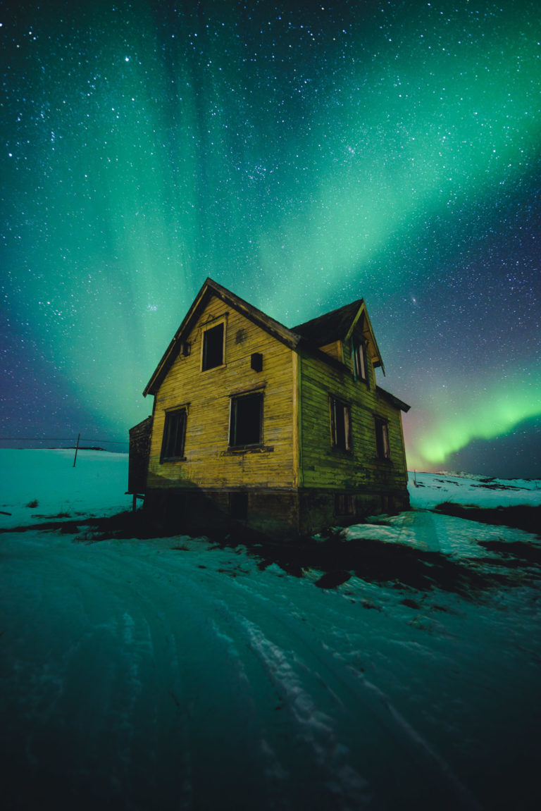 The lights have been turned off for good in the house. Only the northern lights shine. Kvaløya near Tromsø © Vegard Stien / Raw Studios
