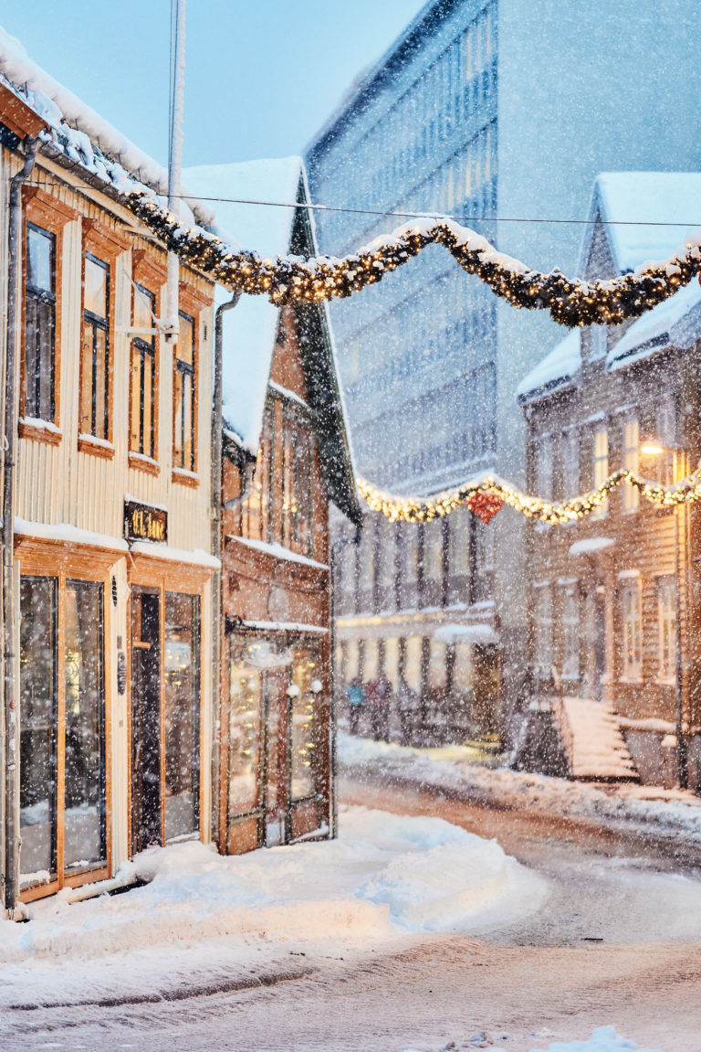A handful of beautiful old houses in Sjøgata, Tromsø, are waiting for Christmas © Vegard Stien / Raw Studios