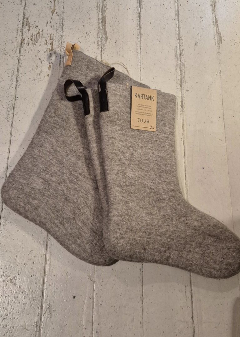 Kartanker are felted wool socks. Traditionally worn inside Sámi reindeer boots (skaller), they also fit modern winter shoes. Guaranteed warm feet © Kronebutikken