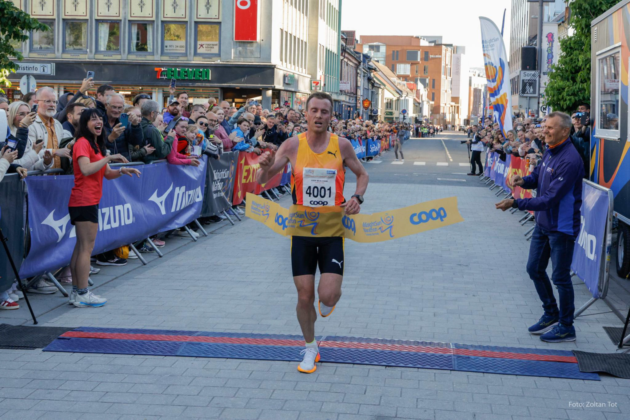 Crossing the finish line in the midnight sun – 42 kilometres in the world’s northernmost marathon. © Zoltan Tot / Midnight Sun Marathon