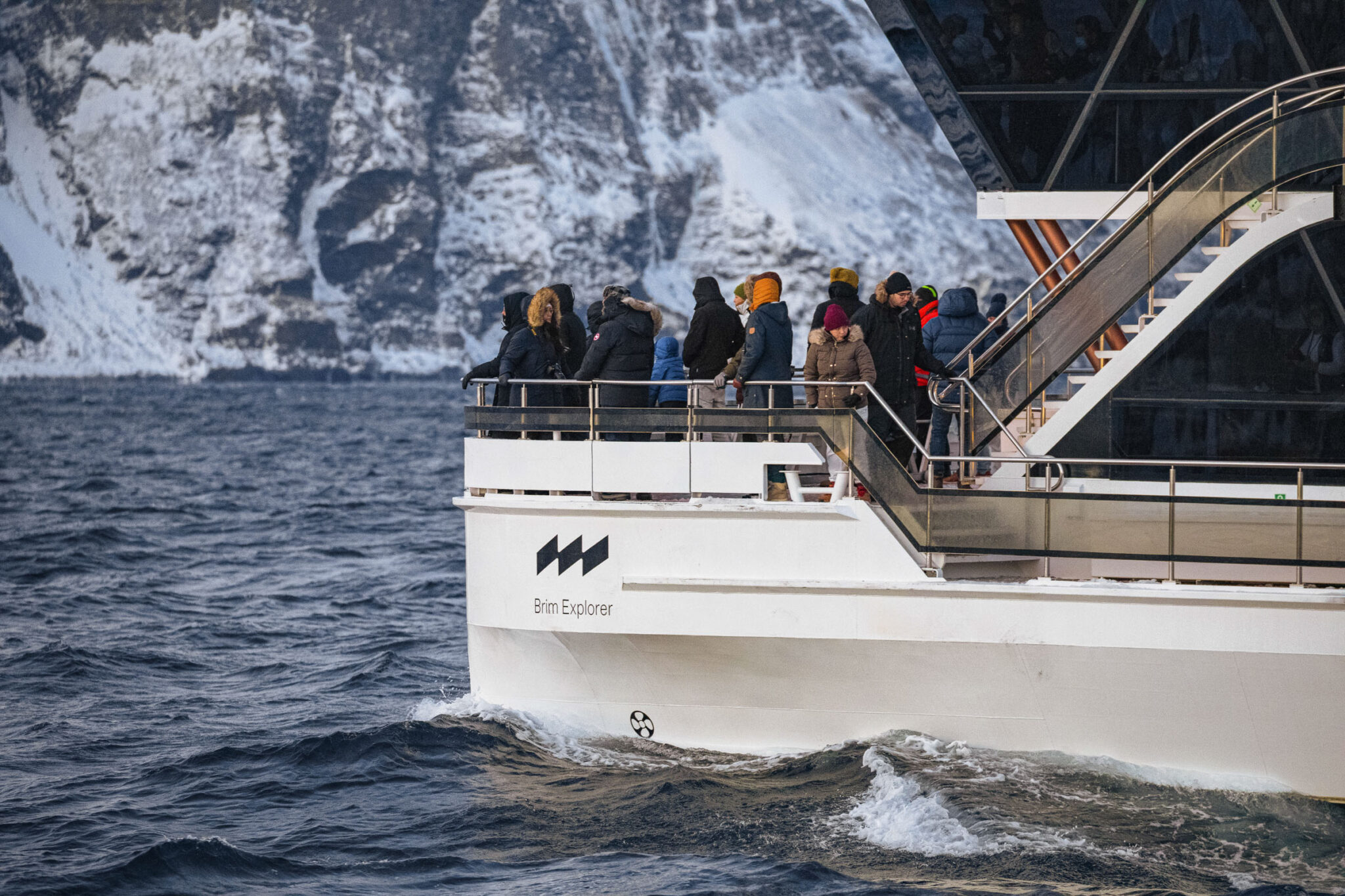 Warm clothes on, out on deck to scan for whales – the mood is both expectant and just a little elevated. This isn’t something we experience every day © Brim Explorer