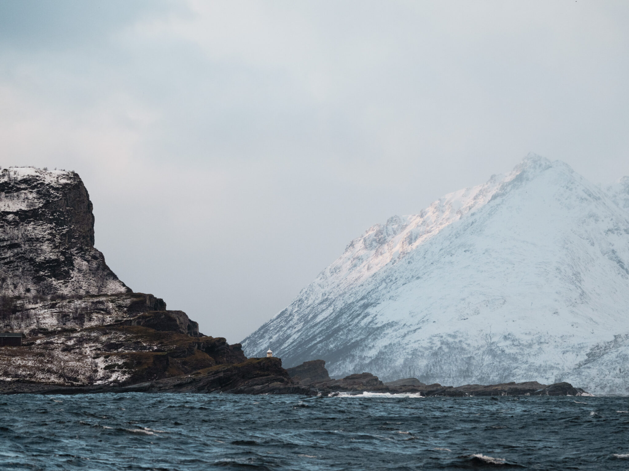 The lighthouse shows the way to the small town of Skjervøy. But our course is set for the outer reaches of the fjord Kvænangen, where we hope to meet the whales. © Marie Nystand Helgesen