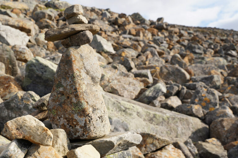 The hike takes place at high altitude and involves crossing rocky terrain. The open landscape is prone to wind and low temperatures. Choose a dry day; the rocks get slippery and dangerous when it’s raining.